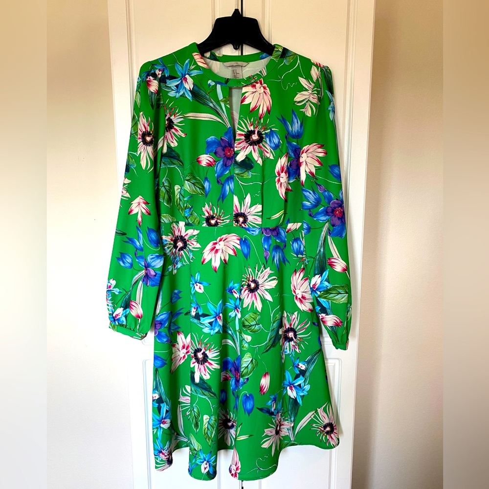 H&M flower print, green dress 38 1/2 inch length, side zip closure, mod style.